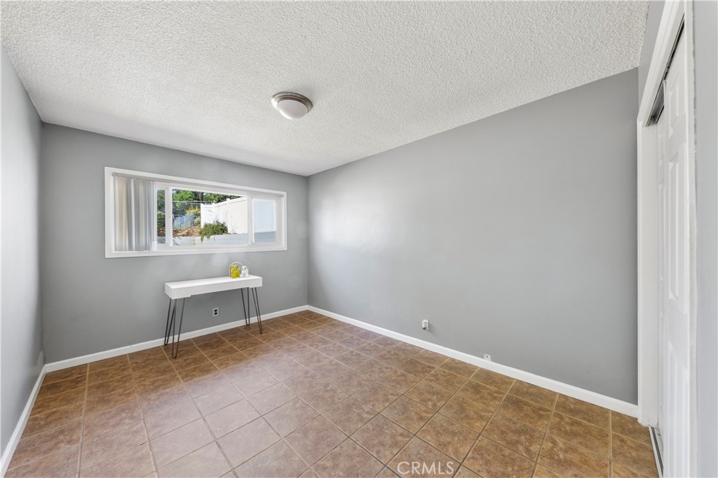 609 Elbrook Drive Fallbrook, CA 92028 - Photo 16 of 30 a view of an empty room with a window