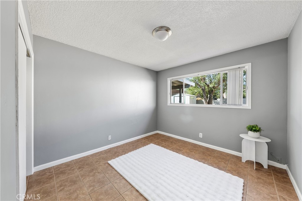 609 Elbrook Drive Fallbrook, CA 92028 - Photo 17 of 30 a view of a room with wooden floor and a window