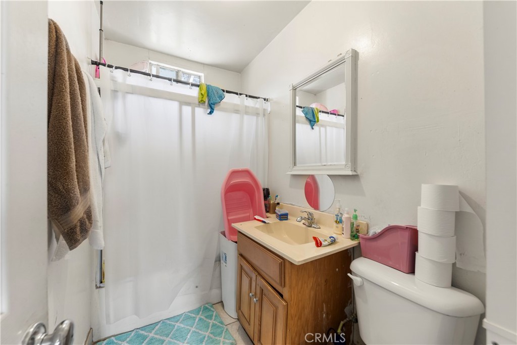 609 Elbrook Drive Fallbrook, CA 92028 - Photo 24 of 30 a bathroom with a sink toilet and shower