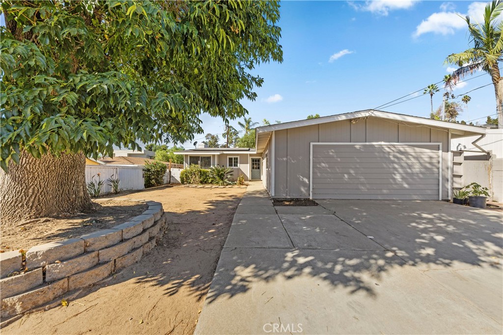 609 Elbrook Drive Fallbrook, CA 92028 - Photo 30 of 30 a front view of a house with a yard and garage