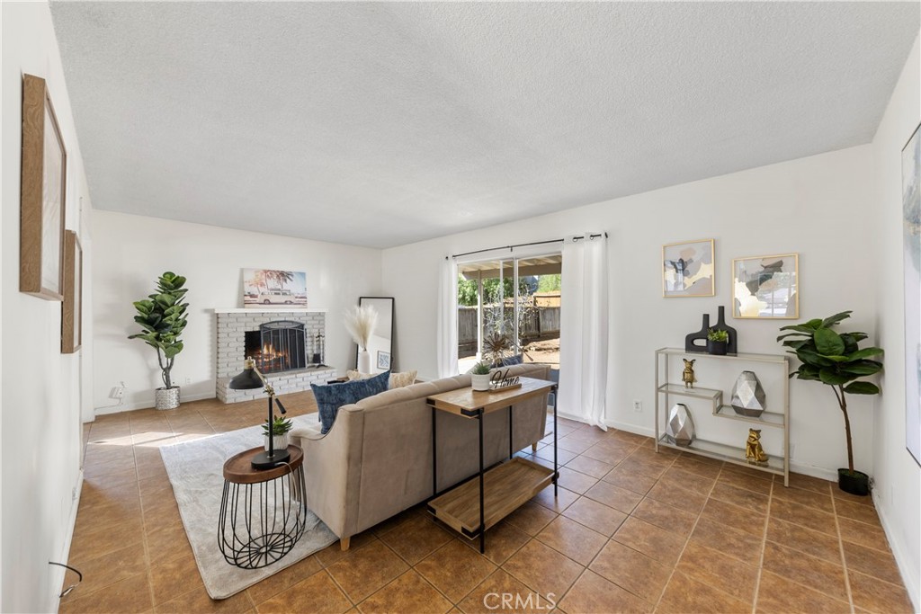 609 Elbrook Drive Fallbrook, CA 92028 - Photo 9 of 30 a living room with furniture a table and a potted plant