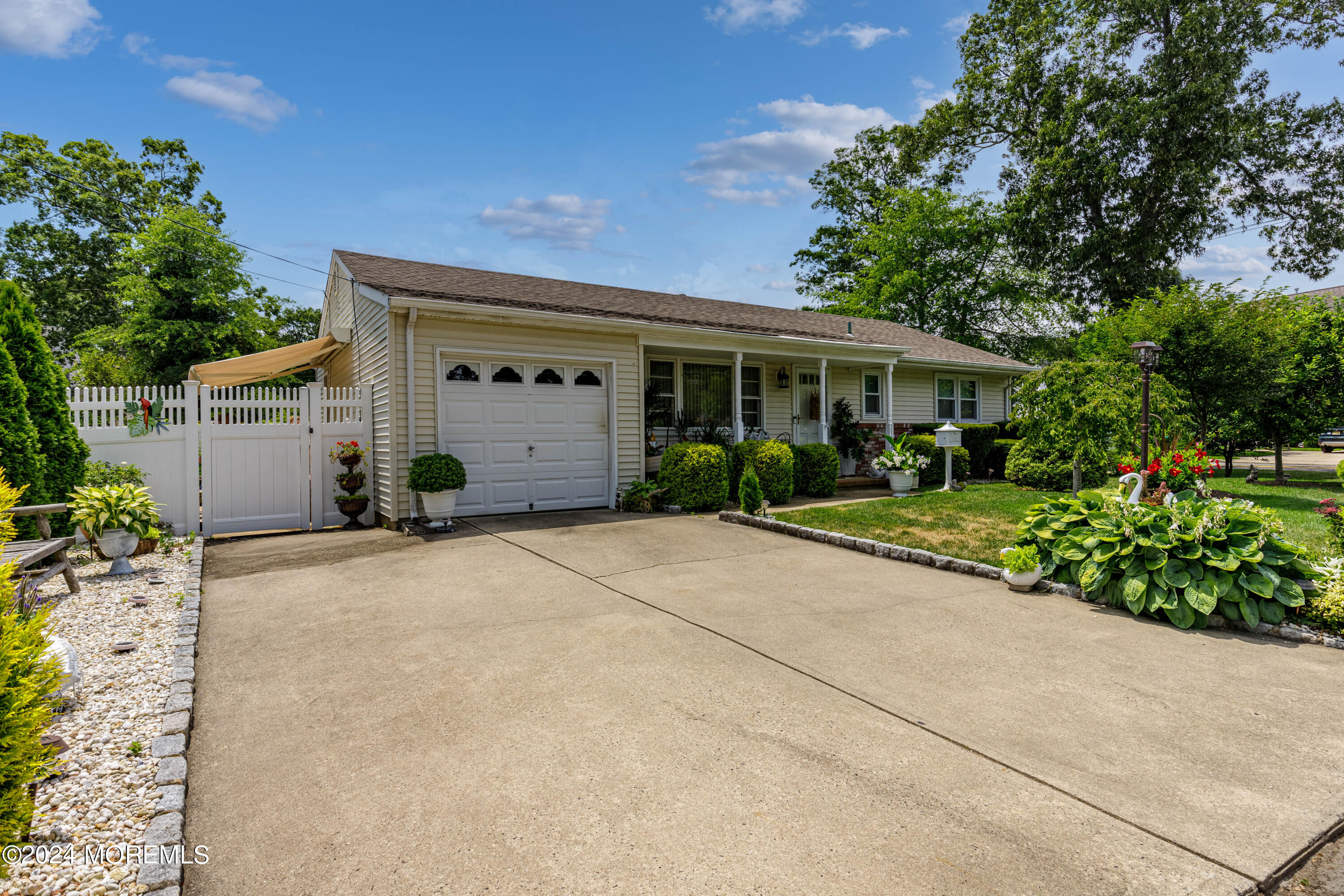 2332 Oak Tree Road Point Pleasant, NJ 08742 - Photo 3 of 20 a view of a house with a garden