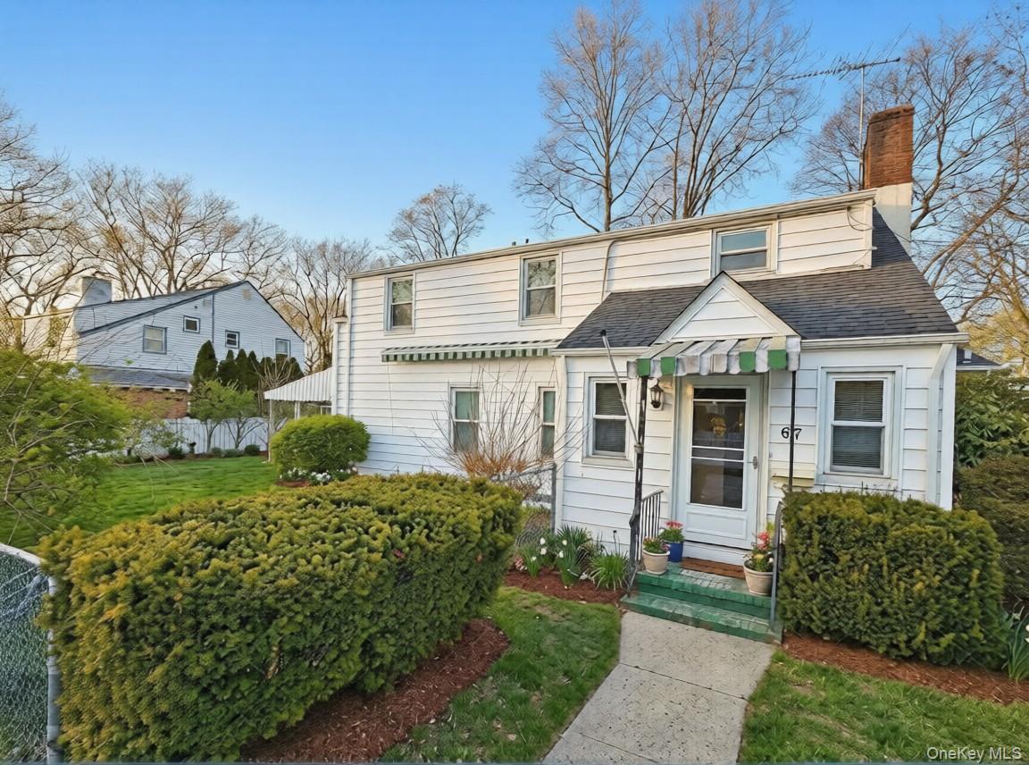 67 Elton Road Garden City, NY 11530 - Photo 1 of 11 house front (staged)