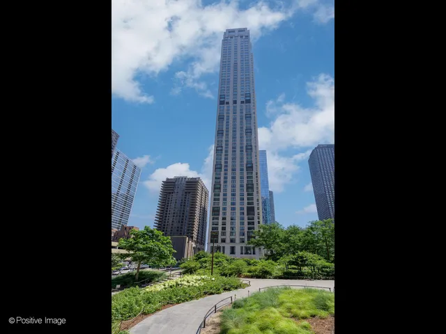 a view of a building with a yard