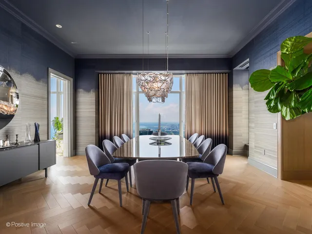 a view of a livingroom with furniture and a potted plant