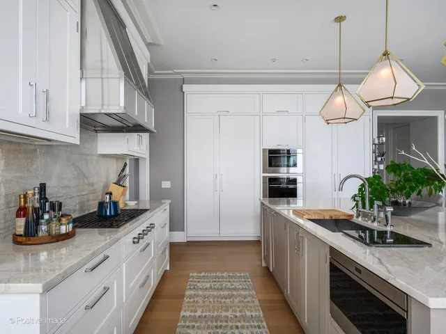 a kitchen with a counter space cabinets and appliances