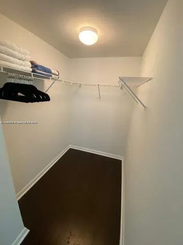 a bedroom with a bed and a table