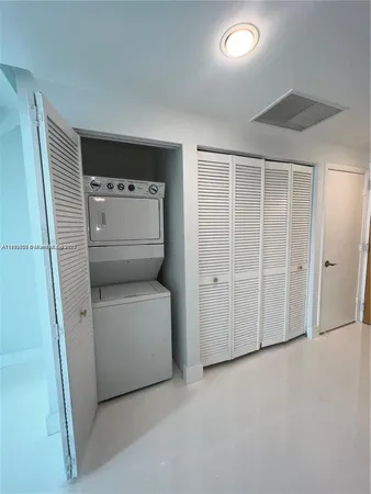 a bathroom with a granite countertop sink a toilet and a mirror