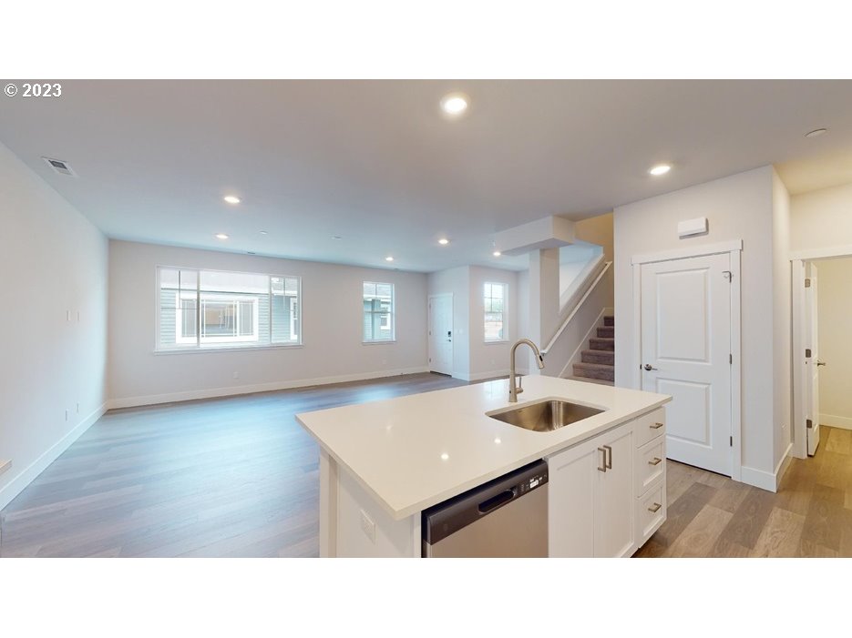 12915 Southwest Tabor Terrace Beaverton, OR 97007 - Photo 6 of 11 a kitchen with a sink cabinets and wooden floor