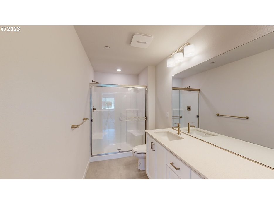 12915 Southwest Tabor Terrace Beaverton, OR 97007 - Photo 9 of 11 a bathroom with a sink shower and a mirror