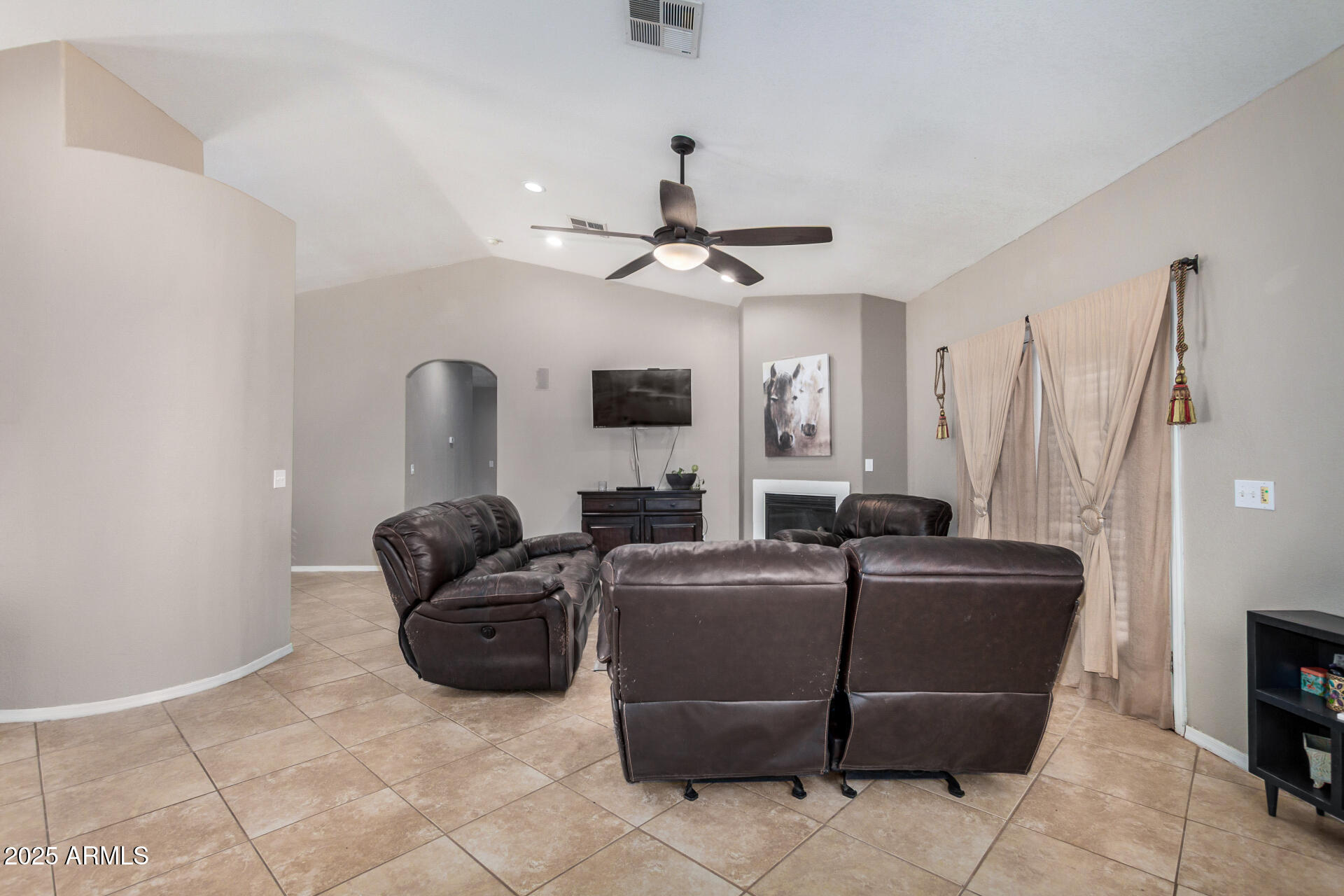 11381 Warrior Road Casa Grande, AZ 85193 - Photo 11 of 73 a living room with furniture a ceiling fan and a window