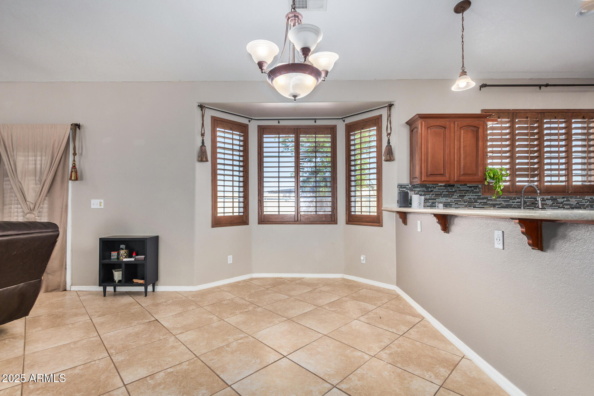 11381 Warrior Road Casa Grande, AZ 85193 - Photo 14 of 73 a kitchen with granite countertop a stove a sink and a refrigerator