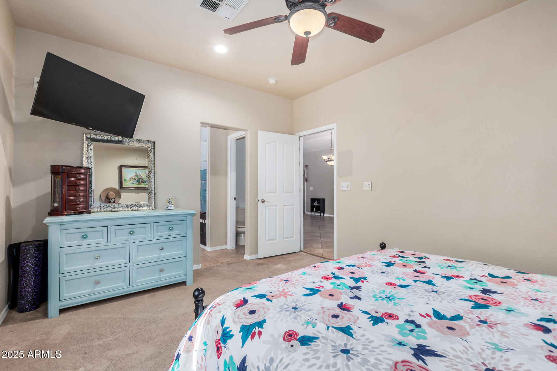 11381 Warrior Road Casa Grande, AZ 85193 - Photo 15 of 73 a bedroom with a bed and a flat tv screen on dresser