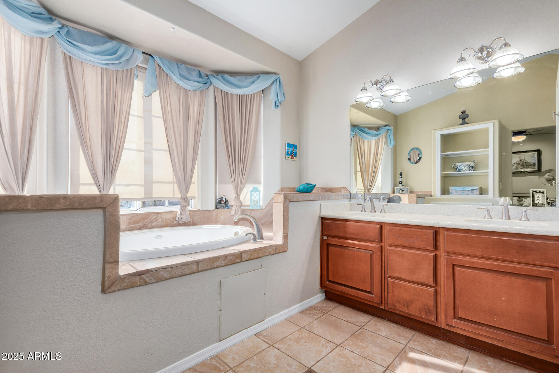 11381 Warrior Road Casa Grande, AZ 85193 - Photo 18 of 73 a bathroom with a double vanity sink mirror and a bathtub
