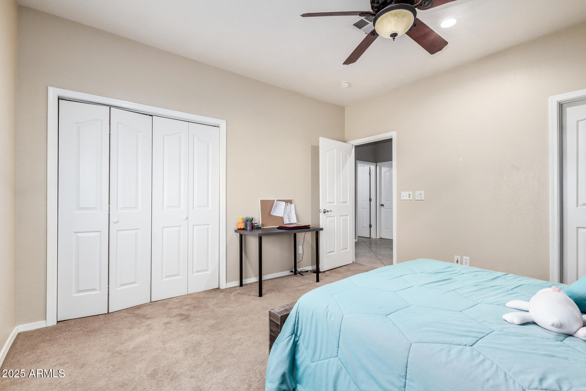11381 Warrior Road Casa Grande, AZ 85193 - Photo 28 of 73 a bedroom with a bed and a chandelier