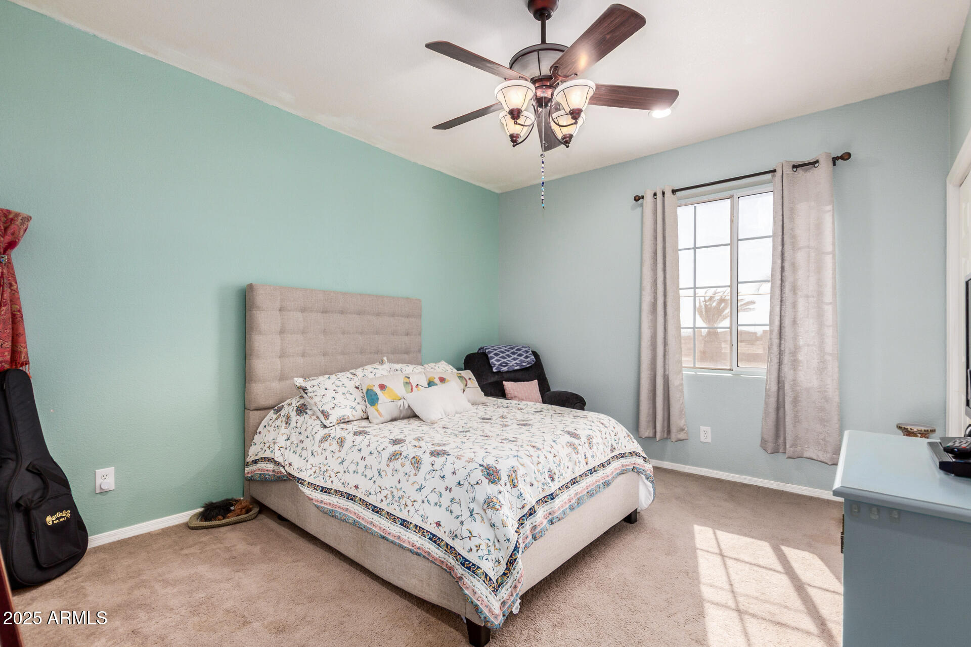 11381 Warrior Road Casa Grande, AZ 85193 - Photo 30 of 73 a bedroom with a bed and a chandelier