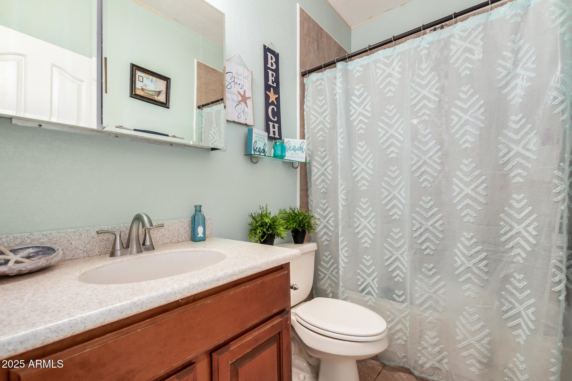 11381 Warrior Road Casa Grande, AZ 85193 - Photo 31 of 73 a bathroom with a granite countertop sink and a toilet