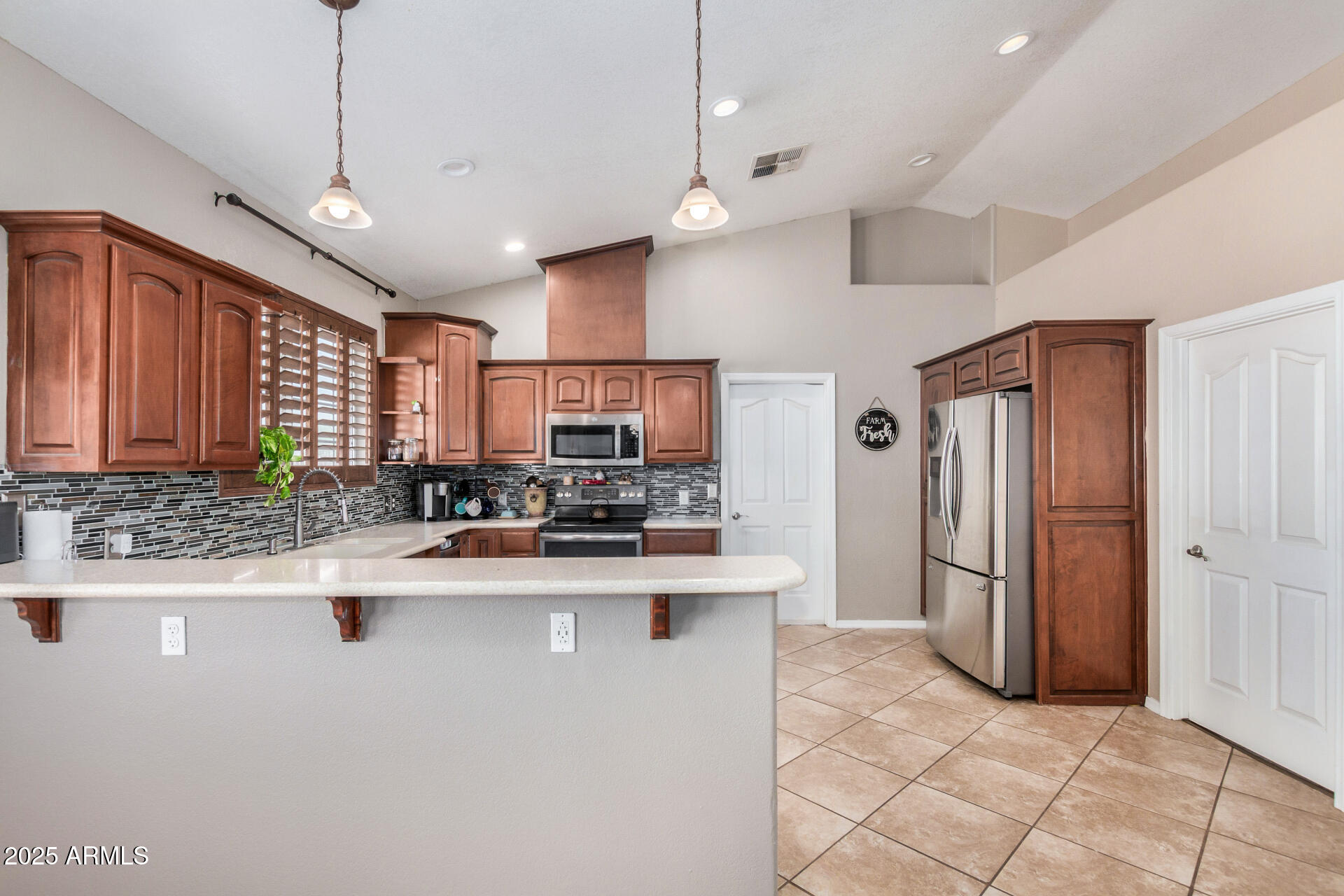 11381 Warrior Road Casa Grande, AZ 85193 - Photo 6 of 73 a kitchen with stainless steel appliances granite countertop a sink refrigerator and cabinets