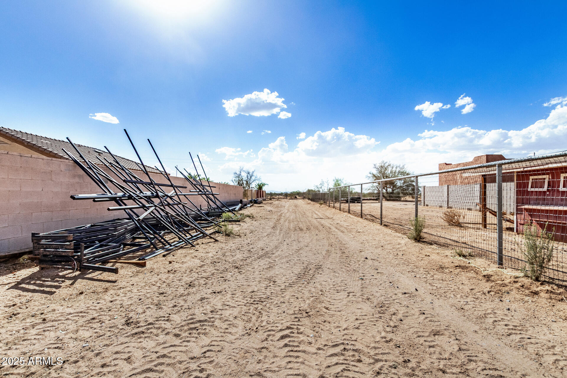 11381 Warrior Road Casa Grande, AZ 85193 - Photo 68 of 73 a view of a dry yard with wooden fence