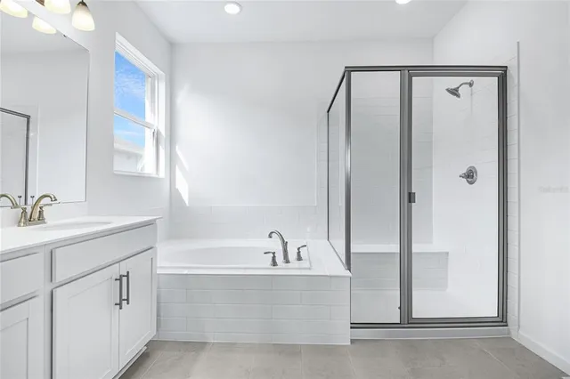 a bathroom with a bathtub and a sink