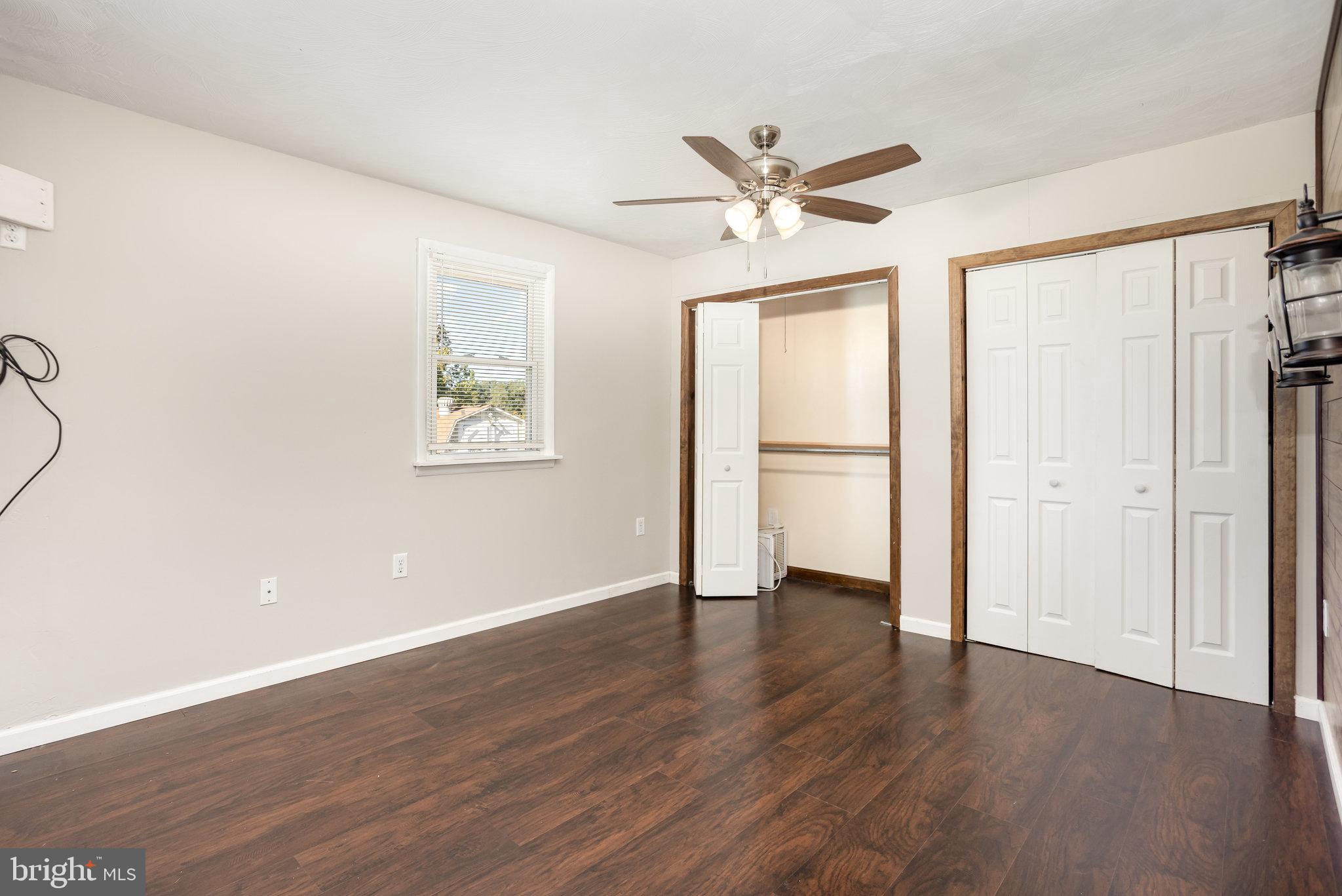 1081 Beaver Creek Road Hanover, PA 17331 - Photo 15 of 33 a view of an empty room with wooden floor and a window