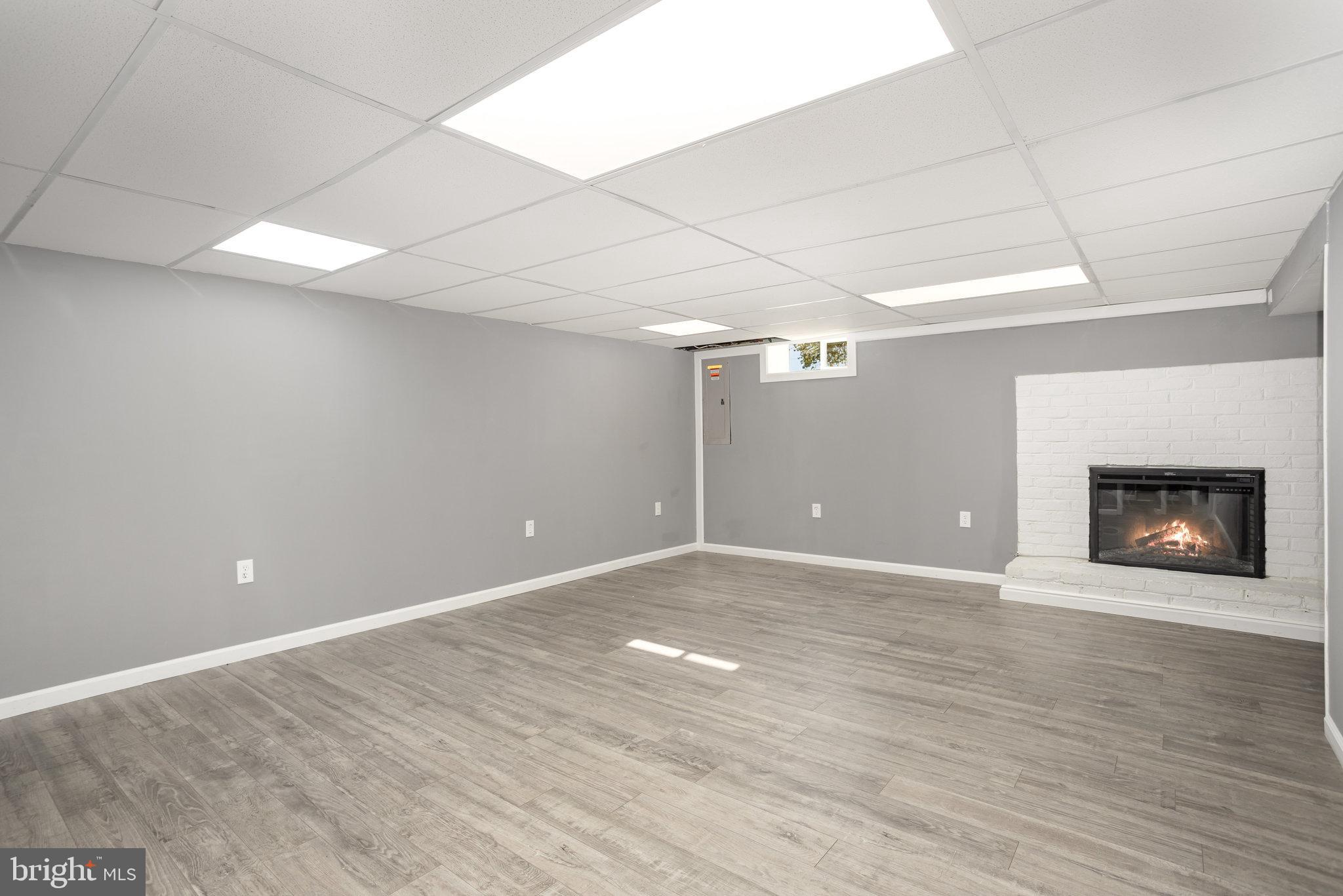 1081 Beaver Creek Road Hanover, PA 17331 - Photo 24 of 33 a view of an empty room with wooden floor and a fireplace