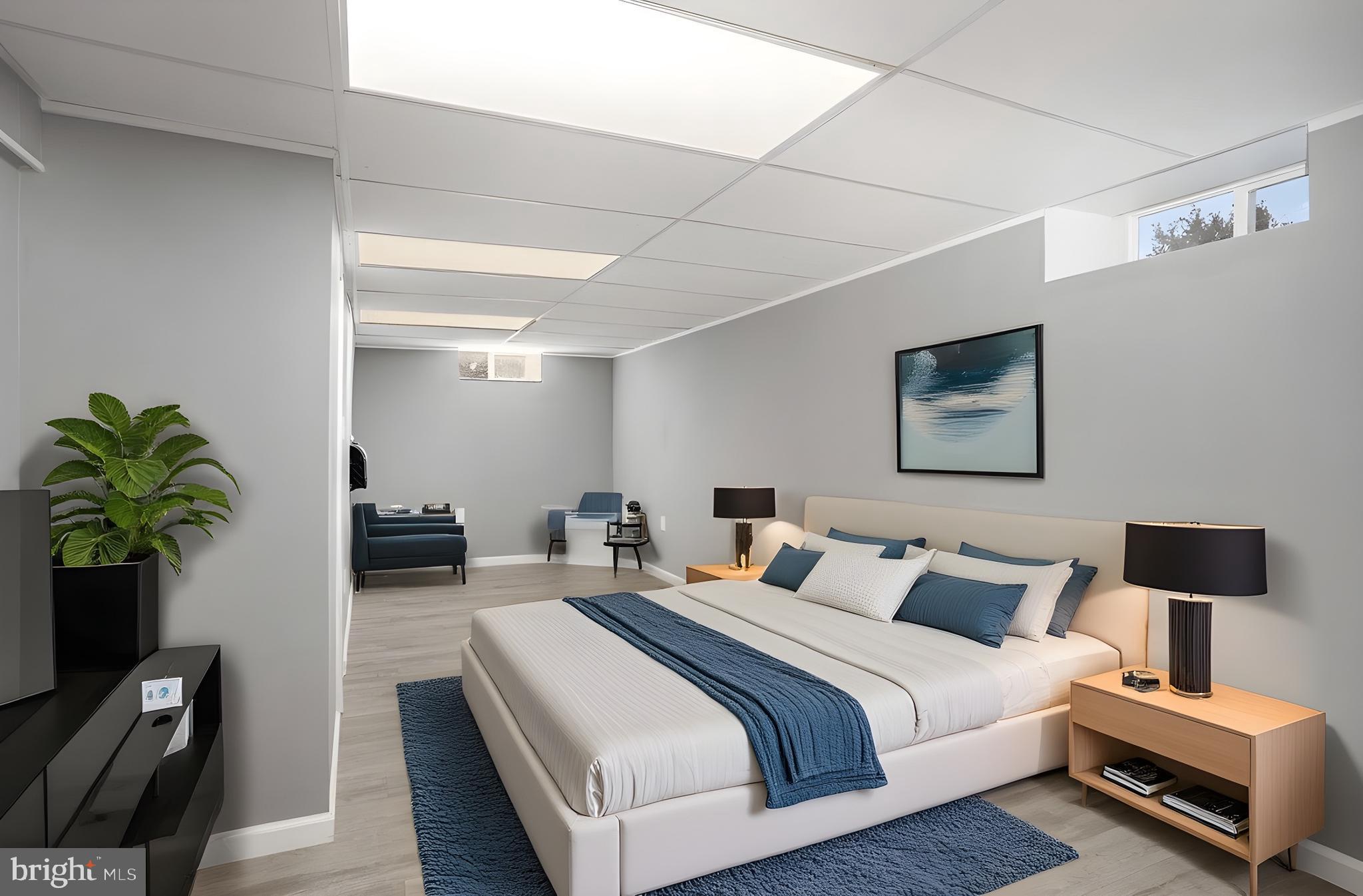 1081 Beaver Creek Road Hanover, PA 17331 - Photo 29 of 33 a bedroom with bed a couch and potted plants with the wooden floor