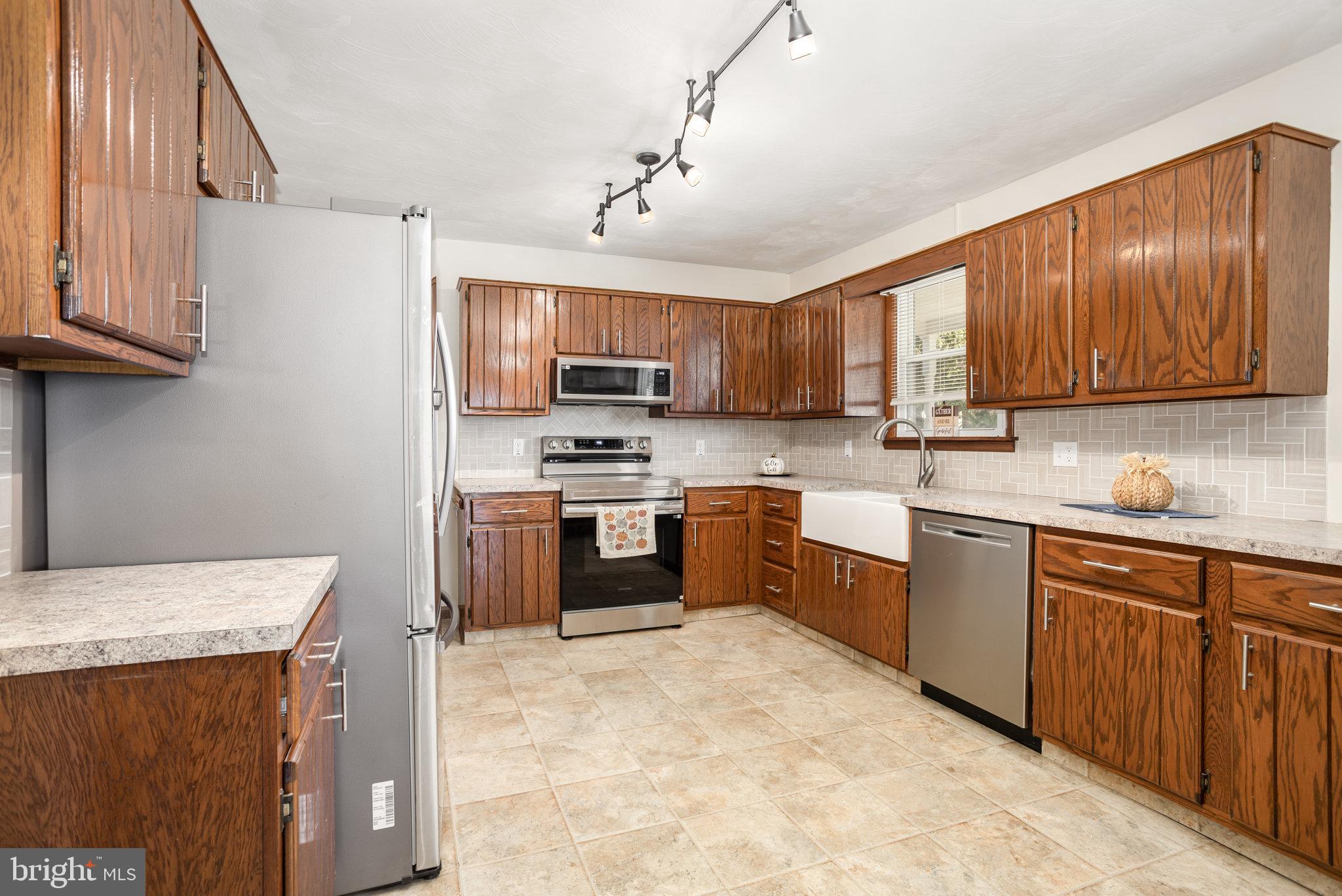 1081 Beaver Creek Road Hanover, PA 17331 - Photo 10 of 33 a kitchen with stainless steel appliances granite countertop a stove sink microwave and refrigerator