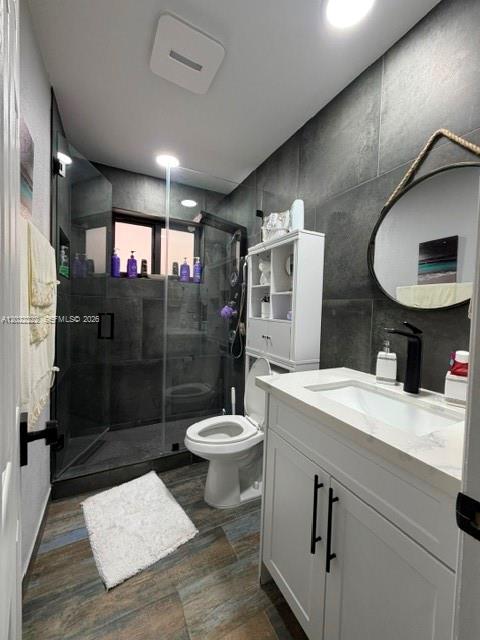 20465 Southwest 200th Street Miami, FL 33187 - Photo 26 of 36 a bathroom with a sink a toilet and shower