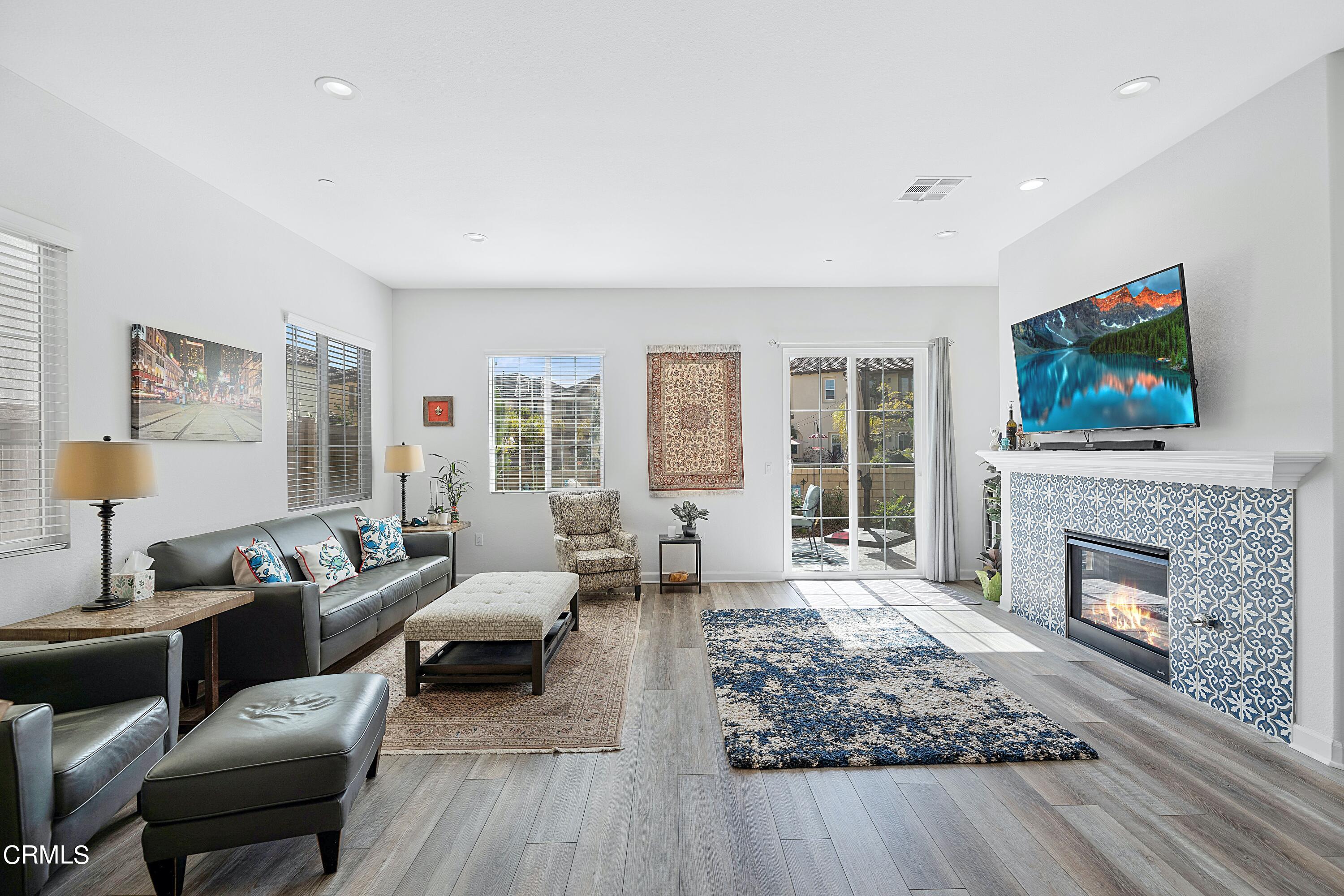 1608 Range Road Oxnard, CA 93036 - Photo 3 of 37 a living room with furniture large window and a fireplace