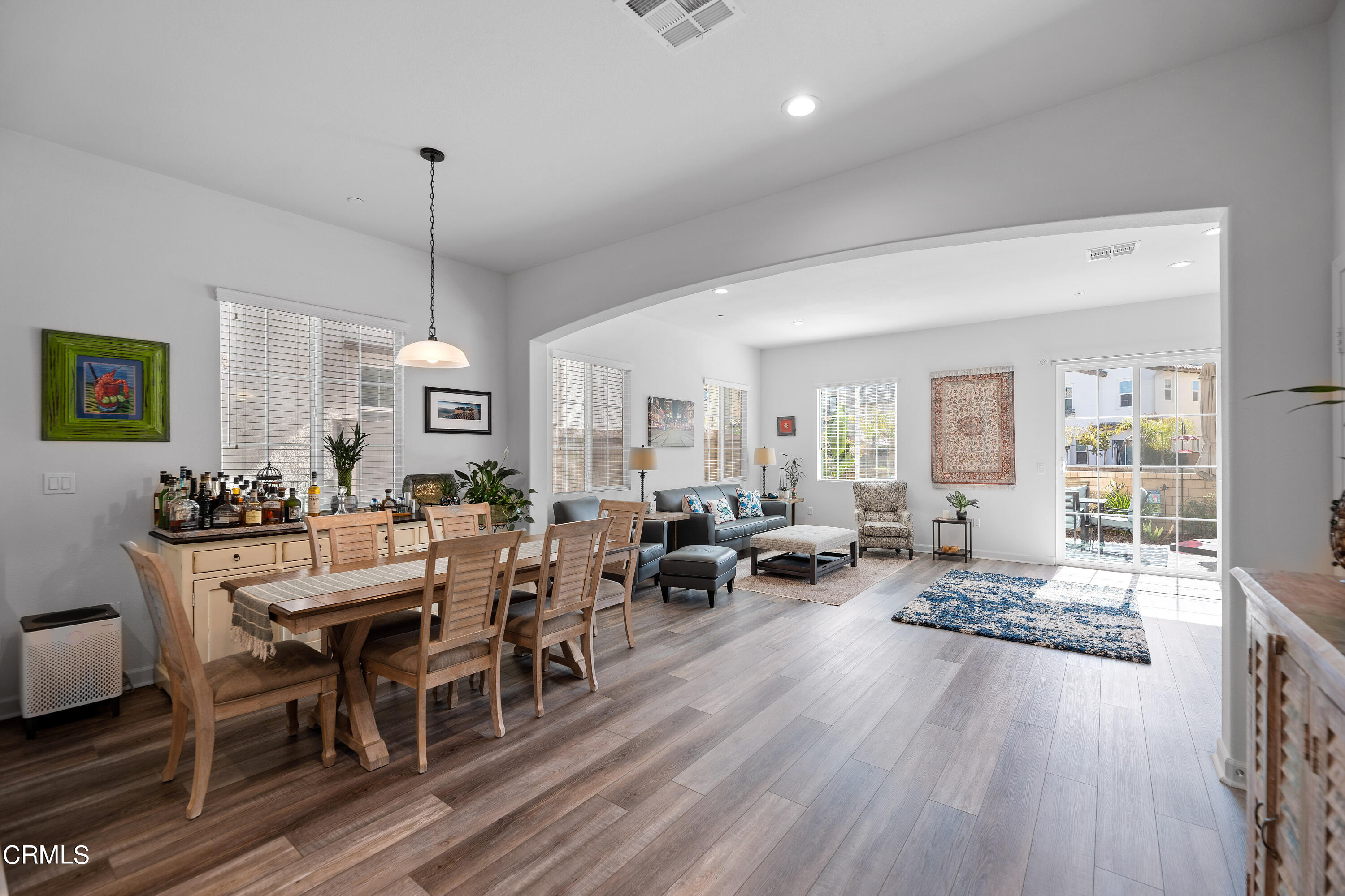 1608 Range Road Oxnard, CA 93036 - Photo 8 of 37 a view of a dining room and livingroom with furniture wooden floor a rug
