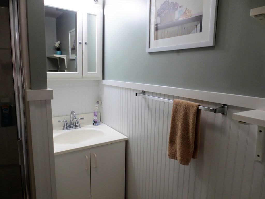 558 Craigville Beach Road Barnstable, MA 02632 - Photo 28 of 35 a bathroom with a sink and mirror
