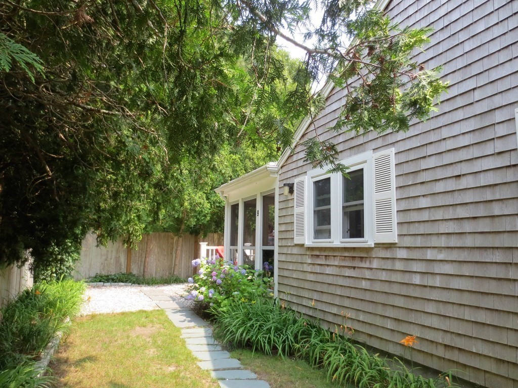 558 Craigville Beach Road Barnstable, MA 02632 - Photo 4 of 35 a view of a house with a yard