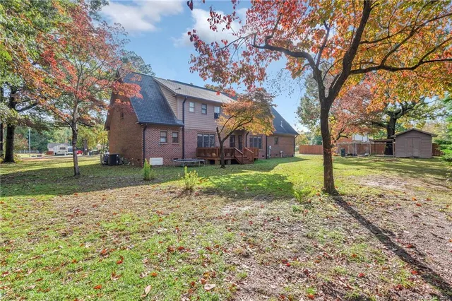 a house that has a tree in front of it