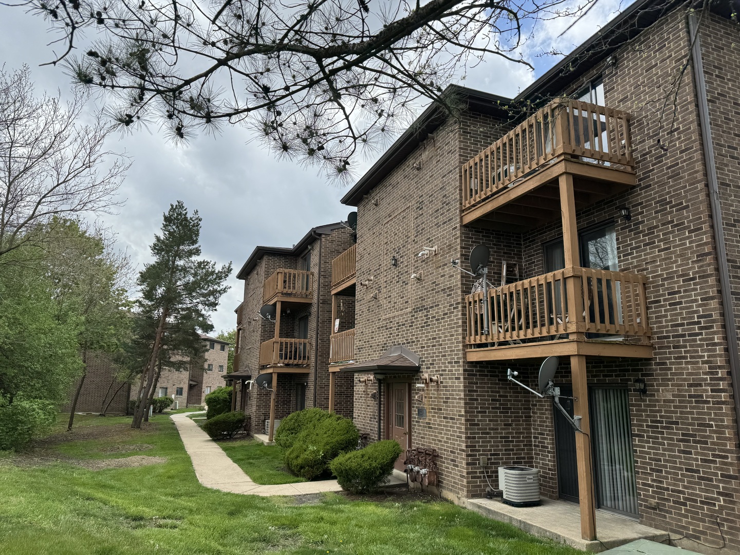 2238 Abbeywood Drive, Unit E Lisle, IL 60532 - Photo 1 of 13 a front view of a house with garden