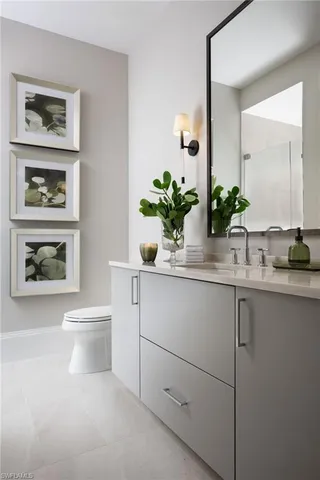 a bathroom with sink and mirror