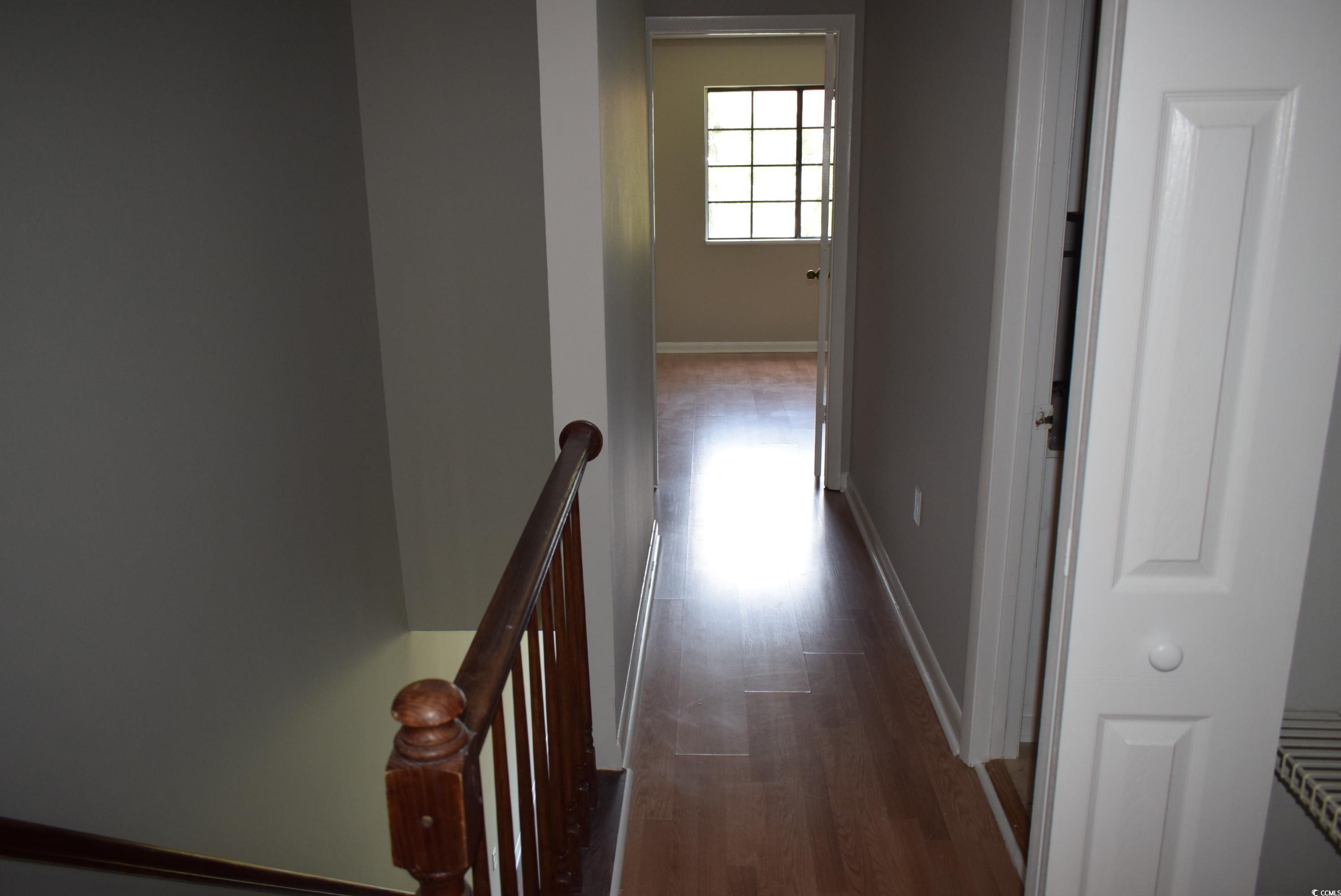 1208 Pinegrove Drive, Unit G Myrtle Beach, SC 29577 - Photo 7 of 15 Corridor featuring an upstairs landing and dark wood-type flooring