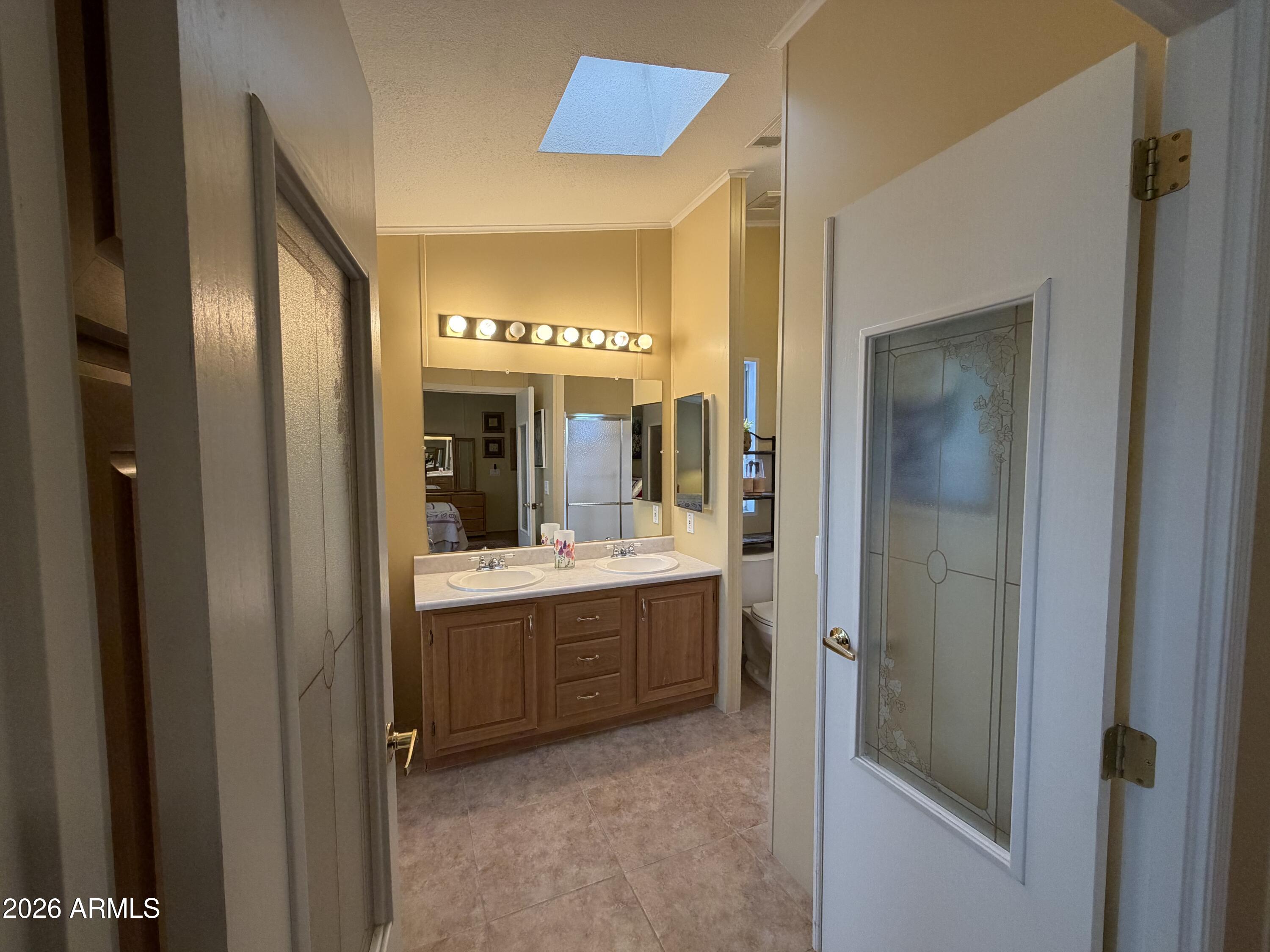 215 North Power Road, Unit 384 Mesa, AZ 85205 - Photo 12 of 27 a bathroom with a bathtub and a sink