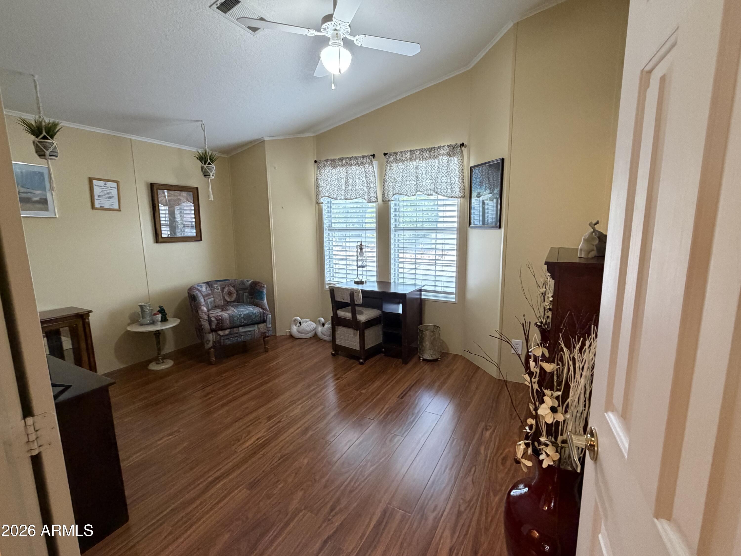 215 North Power Road, Unit 384 Mesa, AZ 85205 - Photo 17 of 27 a living room with furniture and a flat screen tv