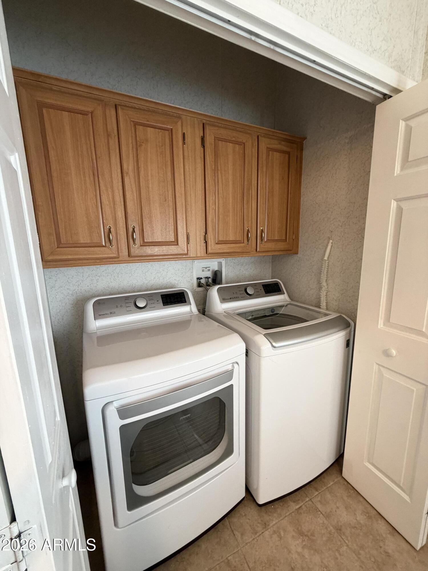 215 North Power Road, Unit 384 Mesa, AZ 85205 - Photo 19 of 27 a utility room with dryer and washer
