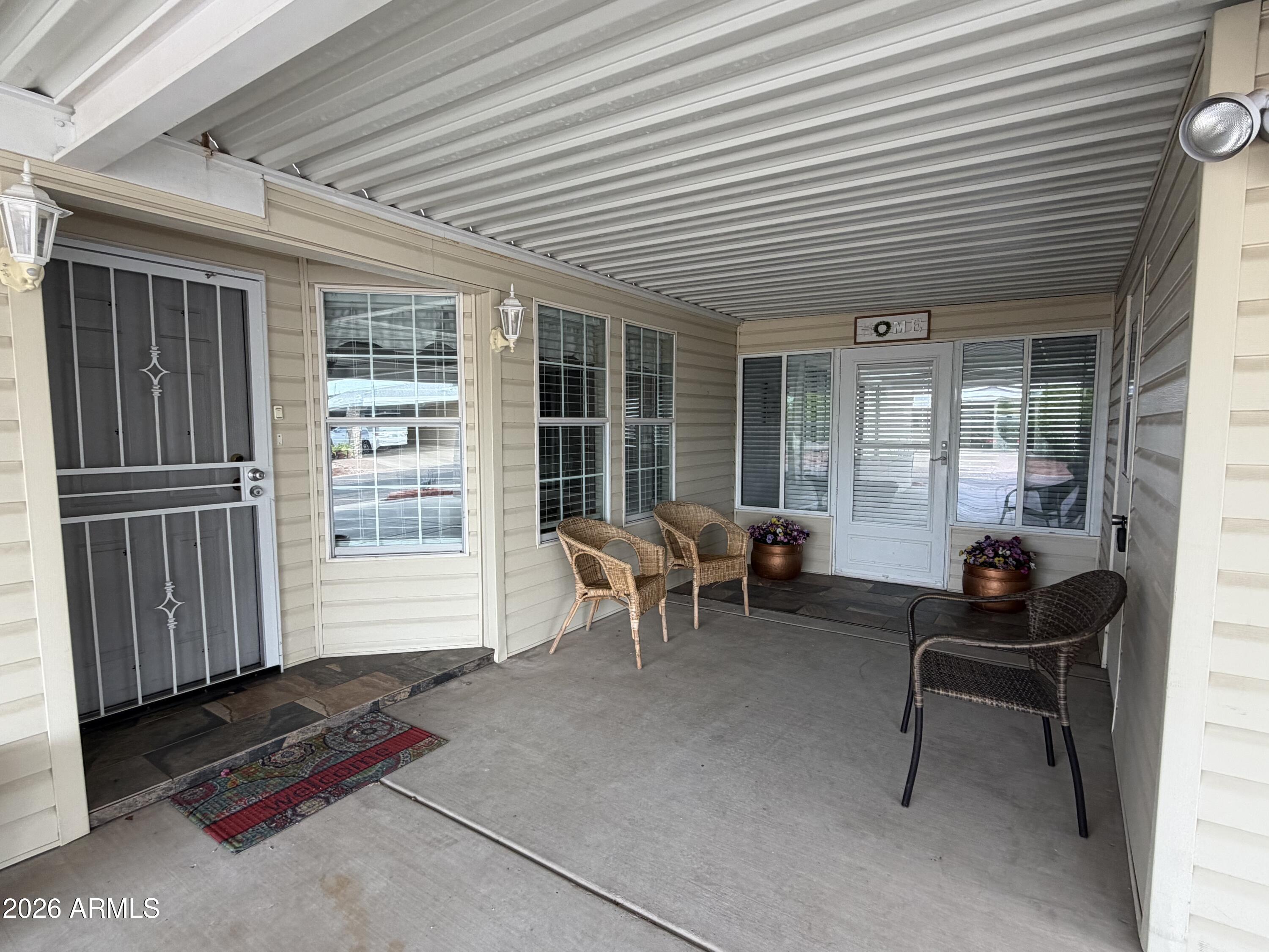 215 North Power Road, Unit 384 Mesa, AZ 85205 - Photo 27 of 27 a backyard of a house with outdoor seating