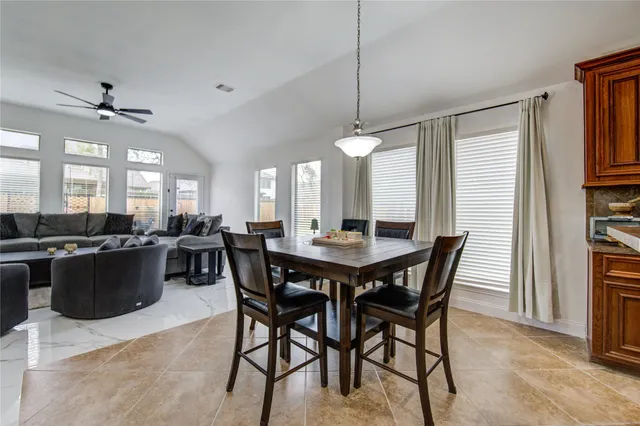 a view of a dining room with furniture