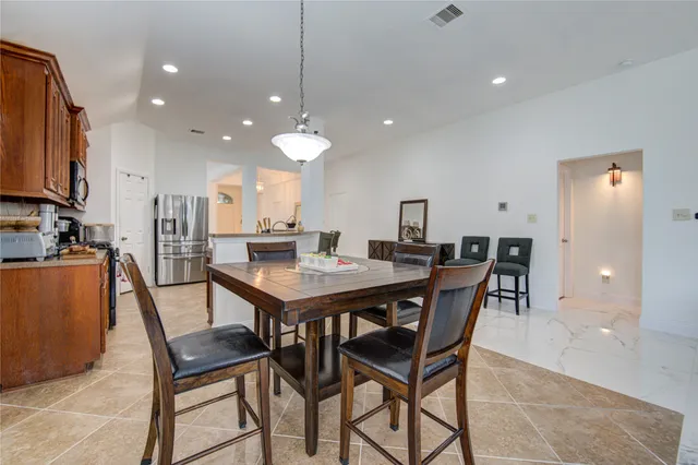 a view of a dining room with furniture