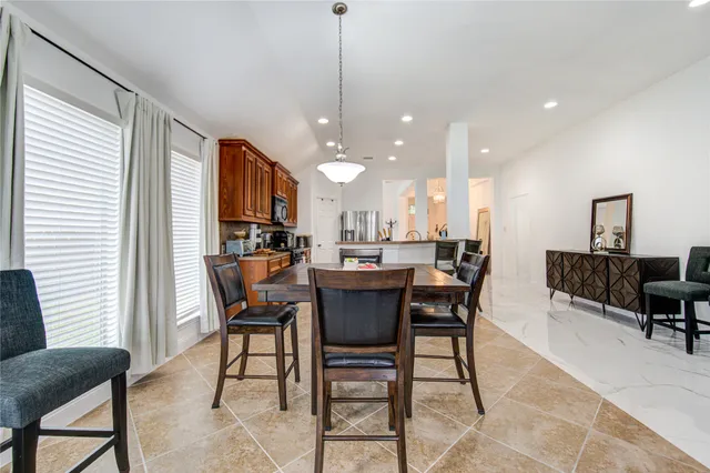 a dining room with a table chairs and a dining table