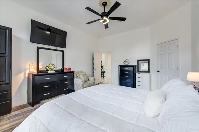 a bedroom with a bed and a dresser