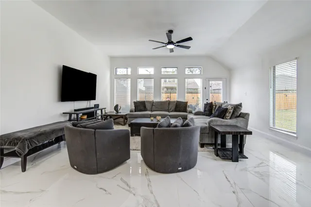 a living room with furniture and a flat screen tv