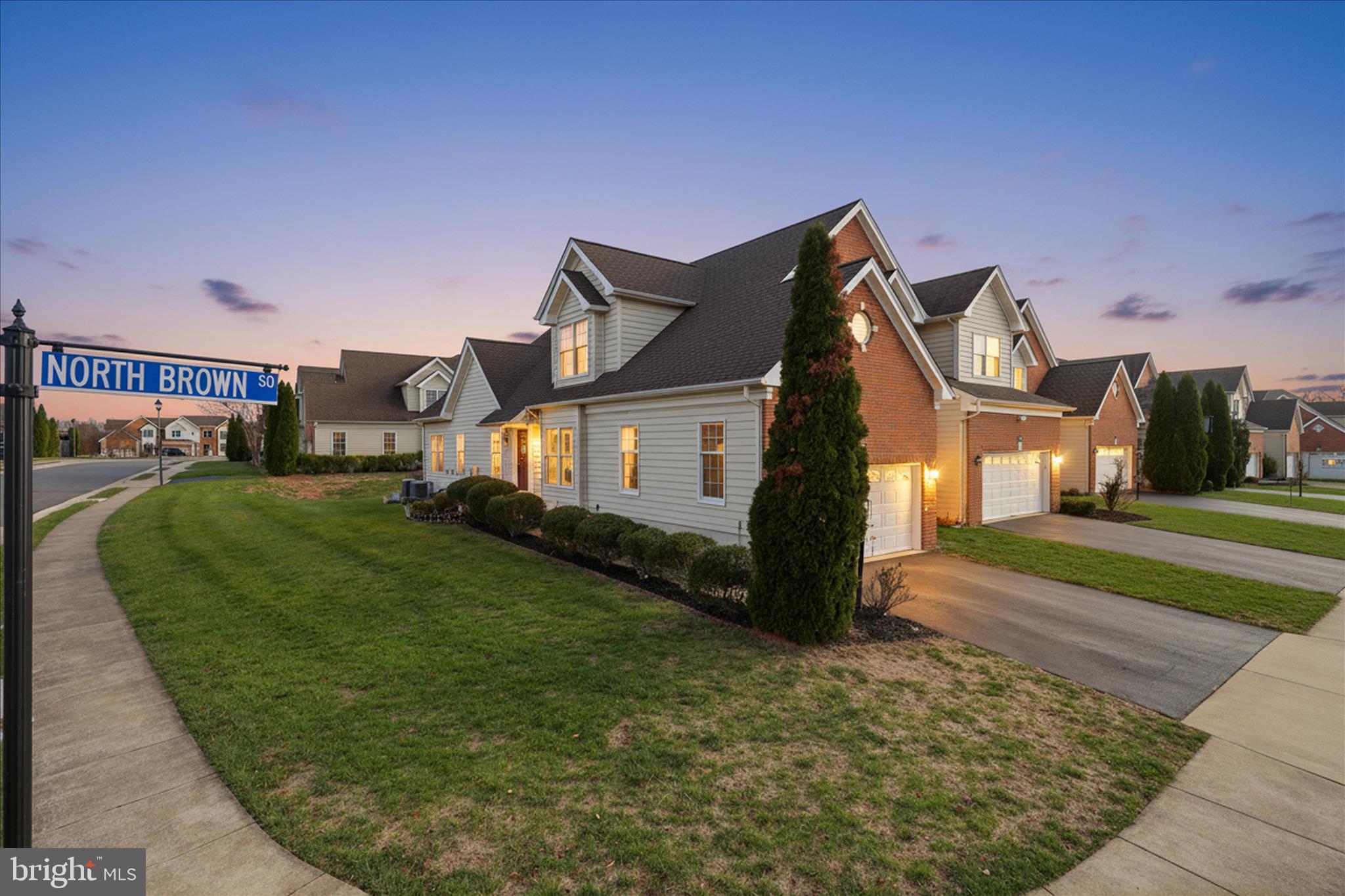 22908 North Brown Square Ashburn, VA 20148 - Photo 1 of 57 a front view of a house with a yard