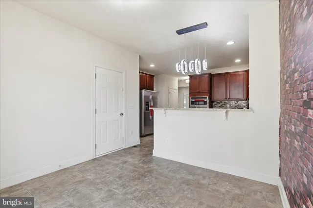 a kitchen with a stove and a cabinets