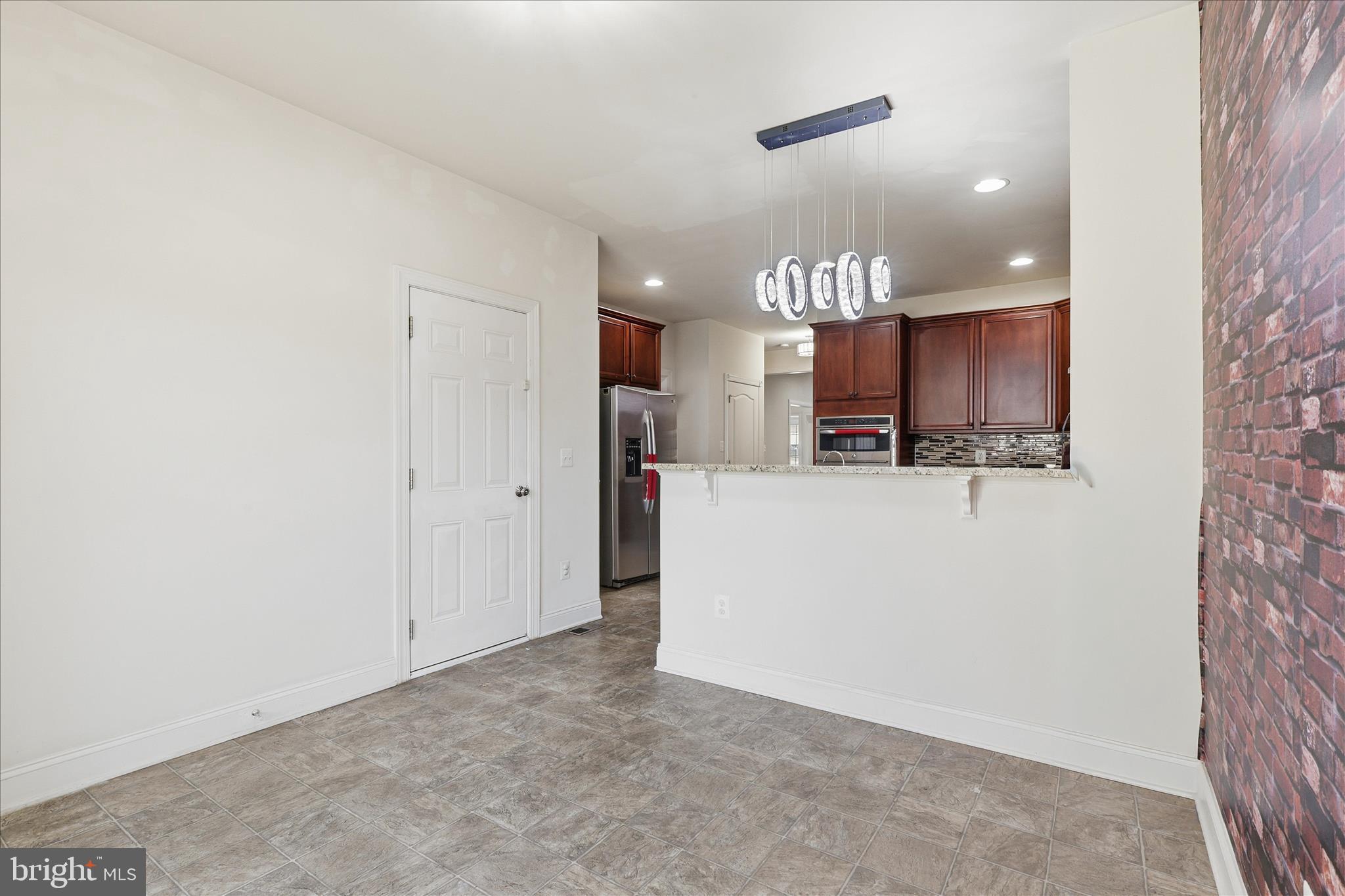22908 North Brown Square Ashburn, VA 20148 - Photo 15 of 57 a view of a kitchen with granite countertop cabinets and a sink