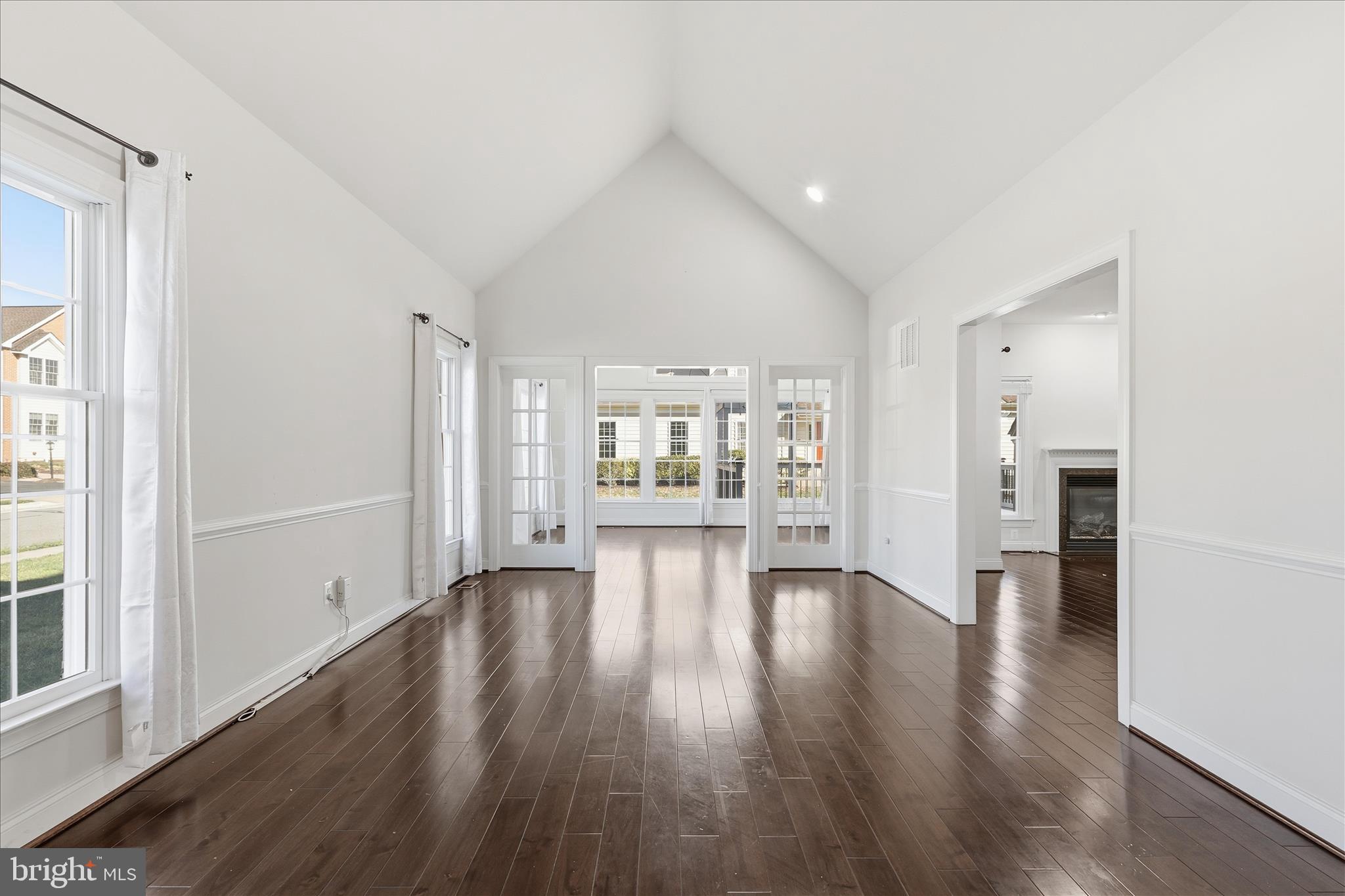 22908 North Brown Square Ashburn, VA 20148 - Photo 20 of 57 a view of an empty room with wooden floor and a window
